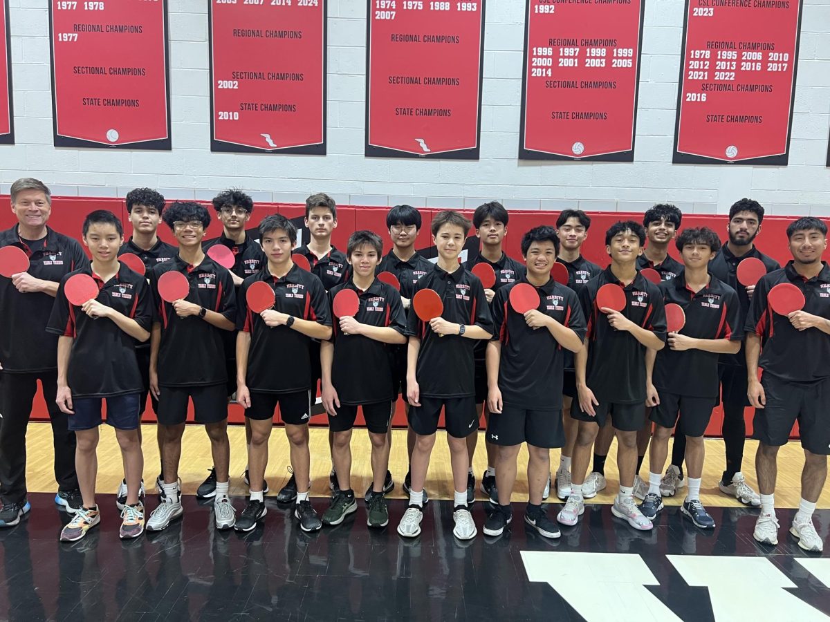 The table tennis team poses for a team picture during the competition. Photo via table tennis team