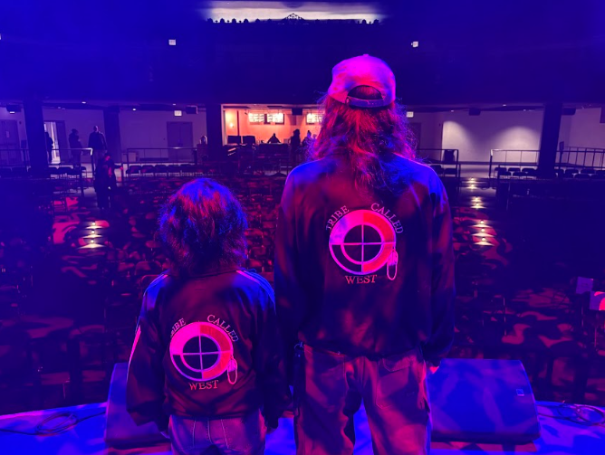 Sophomore Hannah Hufana (left) and senior Laira Biewer (right) stand on stage at the Rooted and Radical Finals Showcase. Photo via Paul Bellwoar.