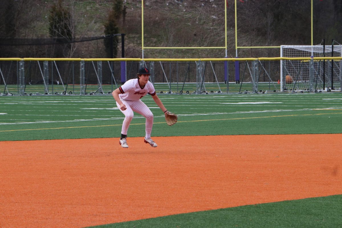 As a Viking is up to bat senior Kevin Foley sets his stance, preparing for the ball. 