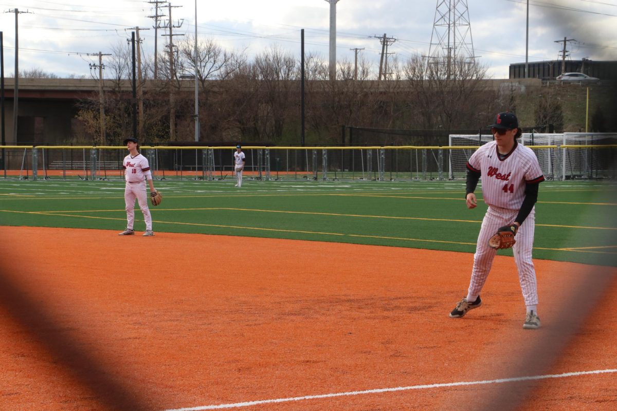 Senior Eli Ordower and Stewart stand at first and second base ready for the next hit.