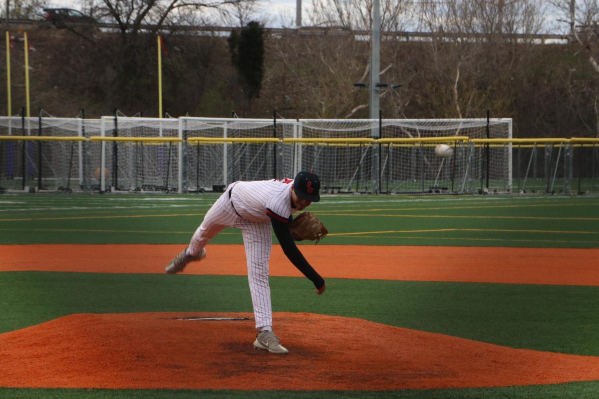 Rayan throws the ball with all his force, trying to strike out the batter.