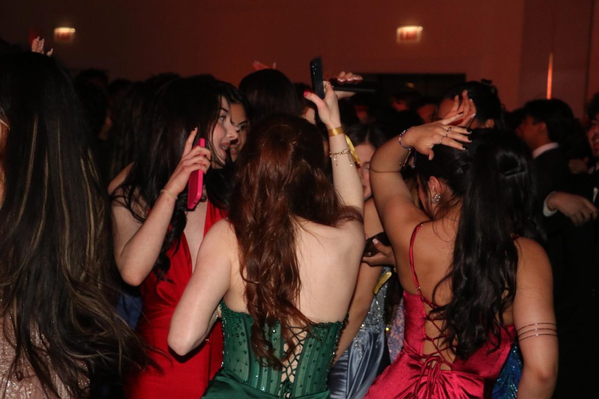 After eating dinner, students make their way to the dance floor. The DJ plays songs to get the students excited and ready to dance with their friends. 