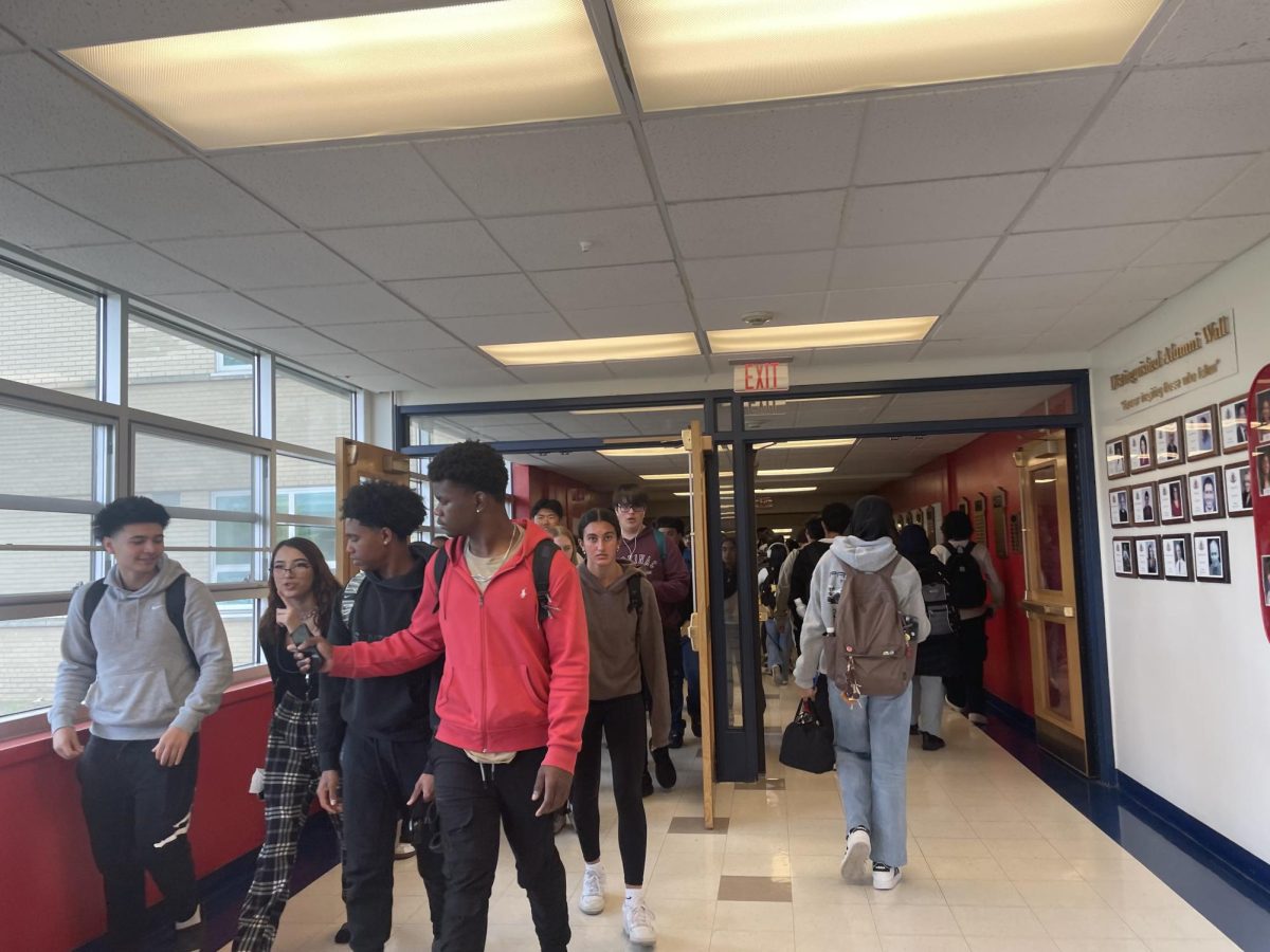 Niles West hallways are filled with students during passing period. 