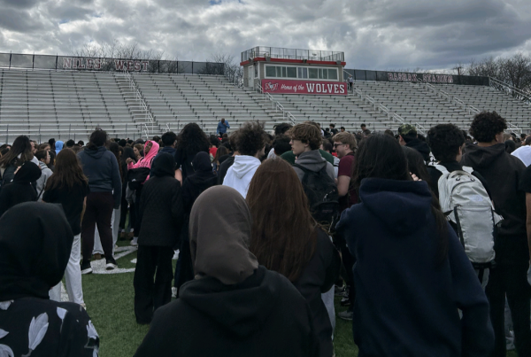 Niles West students and staff evacuated to the football stadium after fire alarms went off. 