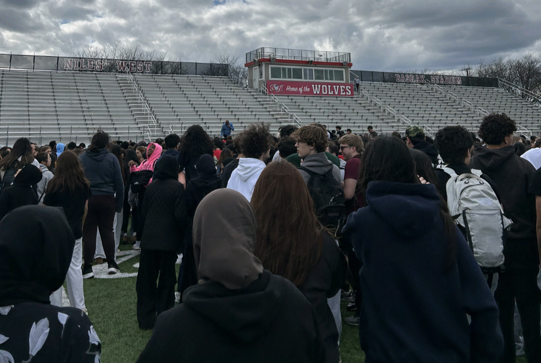 Niles West students and staff evacuated to the football stadium after fire alarms went off. 