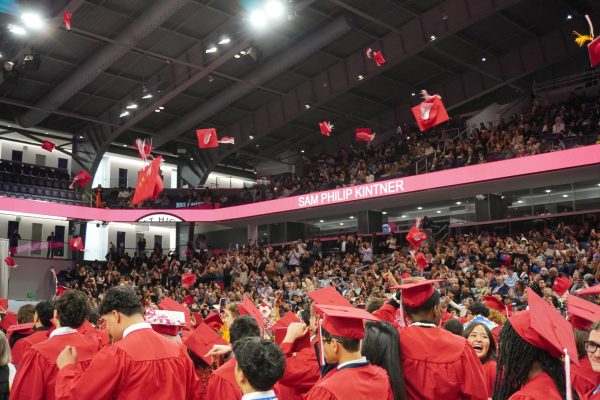 The Class of 2025 throw their caps into the air after receiving their diplomas. 