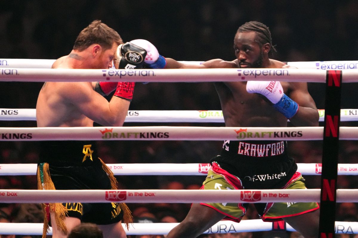 Sep 13, 2025; Las Vegas, Nevada, USA; Canelo Alvarez (black/gold trunks) and Terence Crawford (black/red trunks) box during their super middleweight title bout  at Allegiant Stadium. Mandatory Credit: Joe Camporeale-Imagn Images/ File Photo