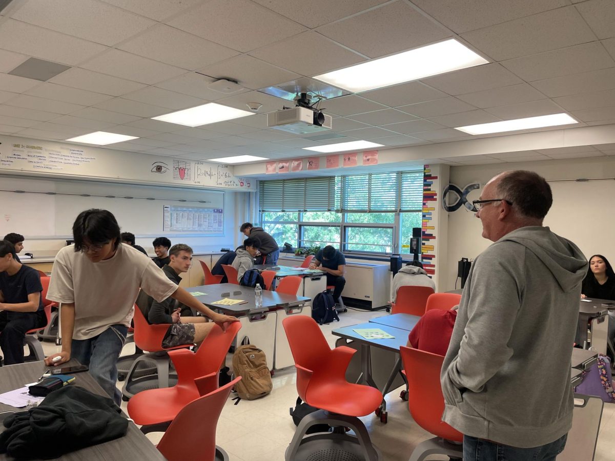 AP Precalculus students get seated before their teacher, James Krzeminski, starts class.