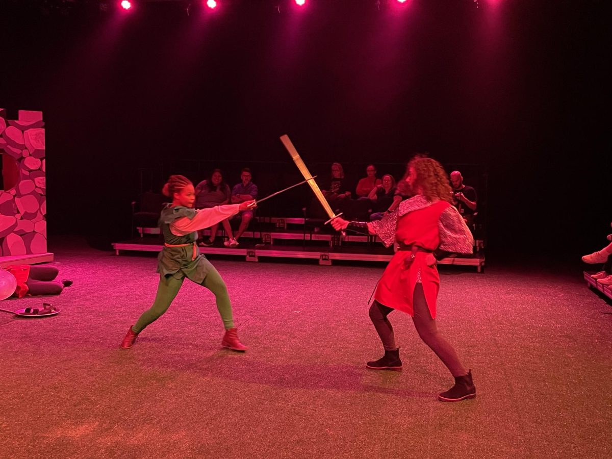 Victoria HooSang fights with Annabelle Macejak, junior, as a guard after the other guards fall down. Macejak was one of the two fight captains alongside Meistininkas. Fight scenes were choreographed by Dave Gonzalez. 