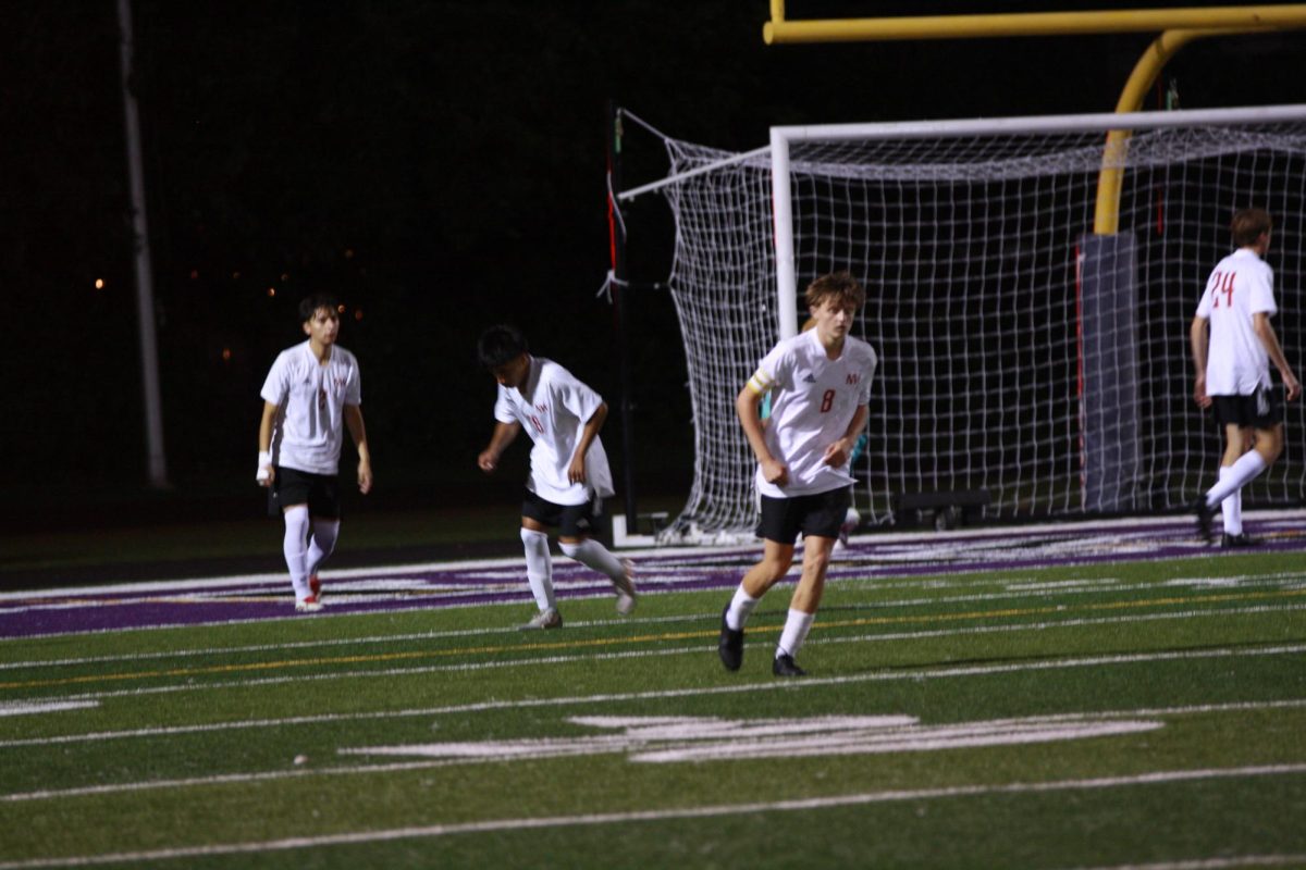 The boys varsity soccer team runs back to their position after North scores their first goal. The team played Niles North on Thursday, Sep. 11th for their annual rivalry game.