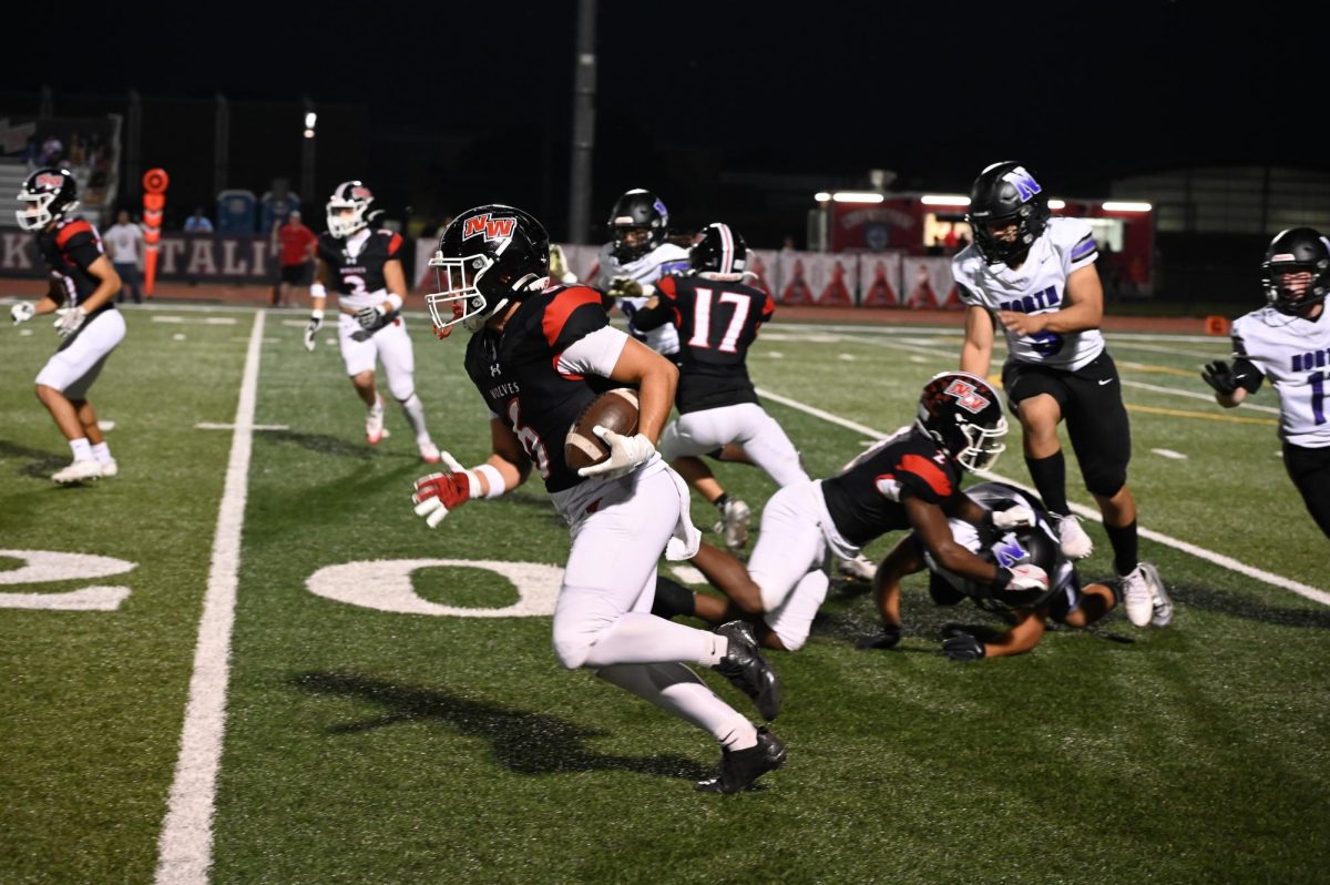 Matthew Padron, senior, returns the kick with Ty'ran Marshall senior giving him a great block to find space to run.