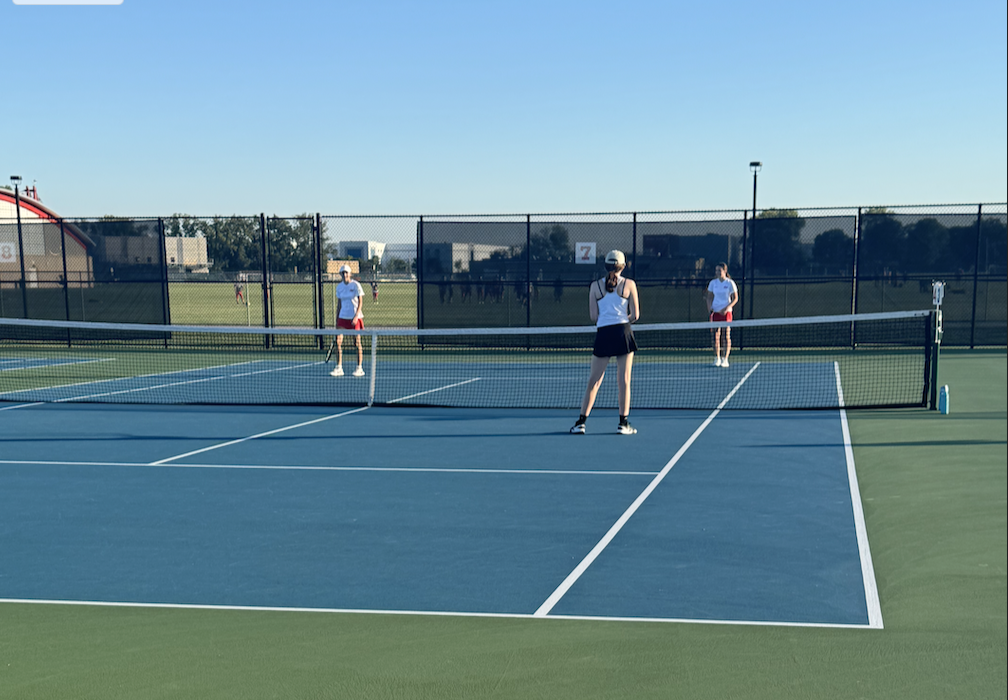 From left, (name & grade) and (name & grade) compete against a Niles North pair.  