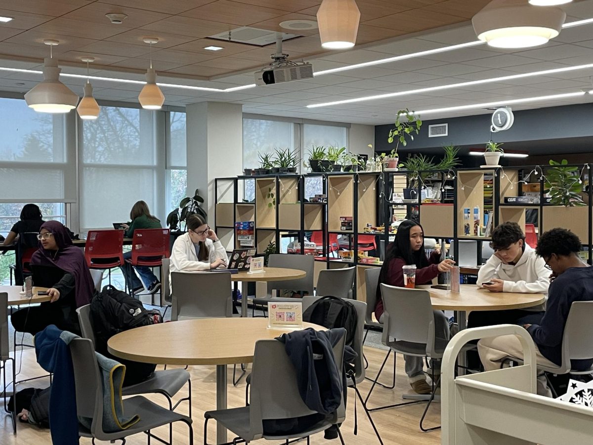 Students work on their laptops in the library during study hall.