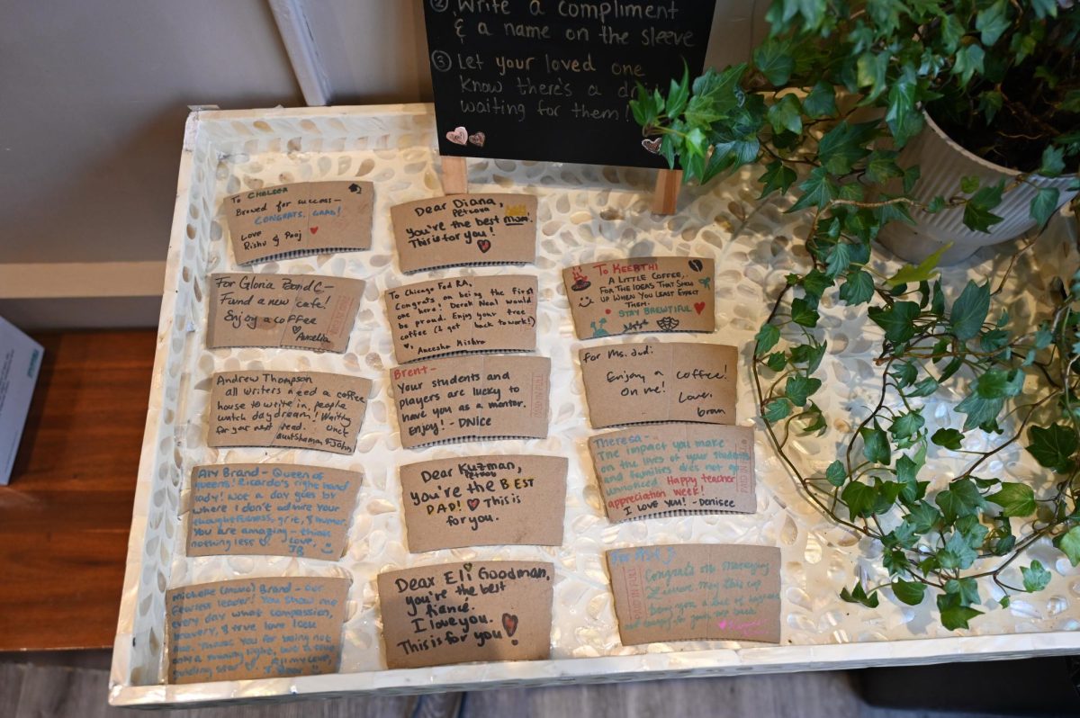  Right as you enter the cafe, you are greeted by a tiny table filled with compliments on cup sleeves written by customers.
