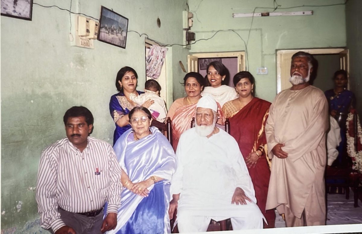 My mom (white dress) the day she returned from Saudi, prepared to give an interview. she poses for the last time in the joint family home, with my great-grandfather (white outfit) praying for a save journey.
