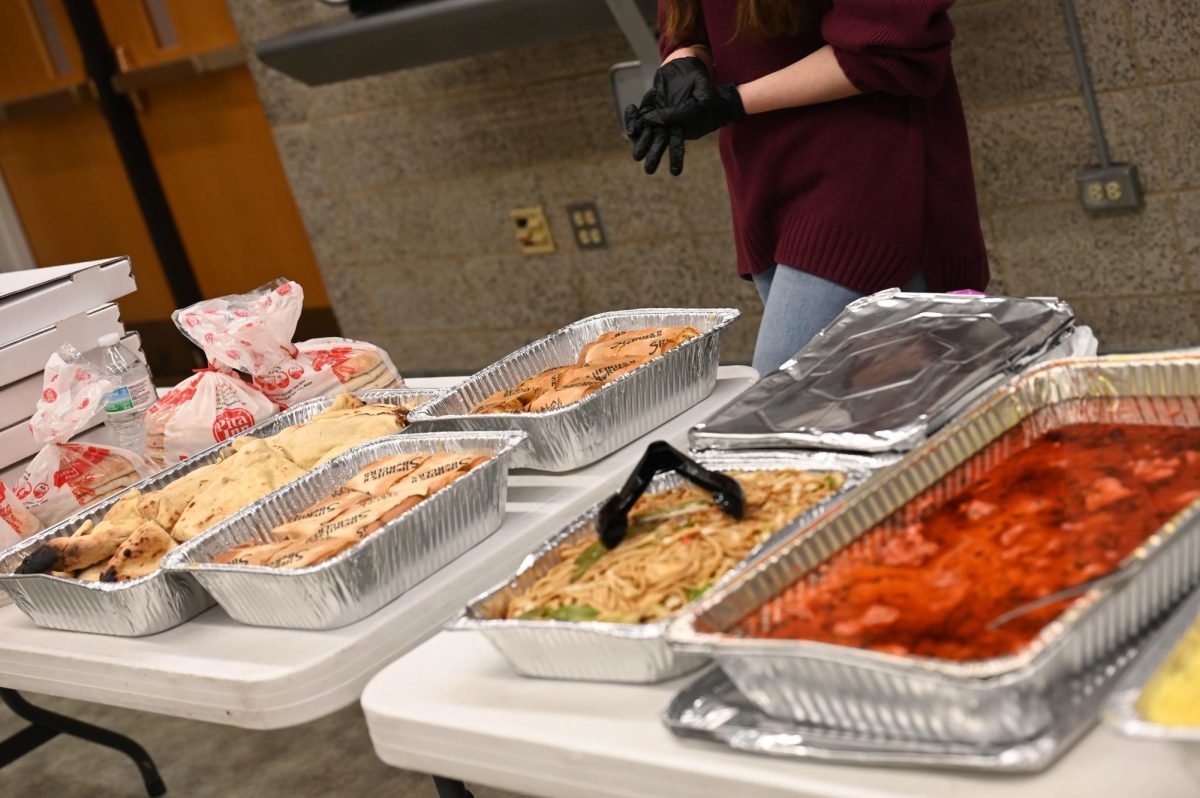Volunteers prepare food on the table for Ramaday attendees to break their fast.
