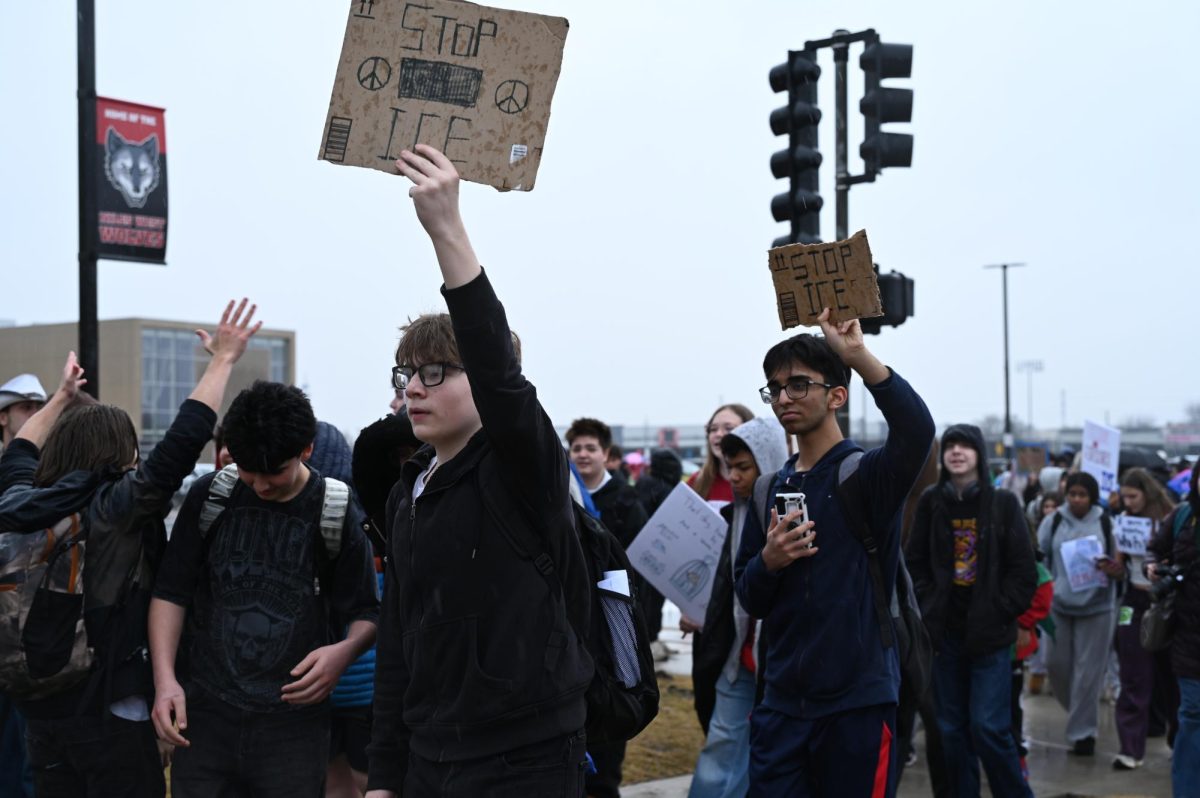 Students participate in a walkout against Immigration and Customs Enforcement on Friday, March 6.  Participants walked out of school during period 6 to protest recent ICE activity happening across the country. Students held handmade signs using a variety of materials including cardboard and poster board. 