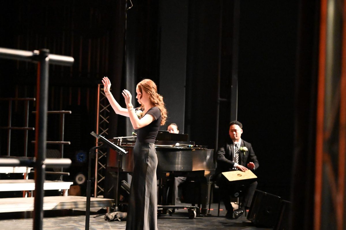 Sarah Van Hees, senior, orchestrates for the first time in Concert Choir (Treble) with the song "I'm On My Way."