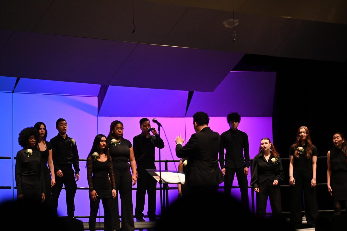 One Voice performs "Lamentation of Jeremiah" and "Rainbow Connection." It is an honors choir composed of students from all grade levels.