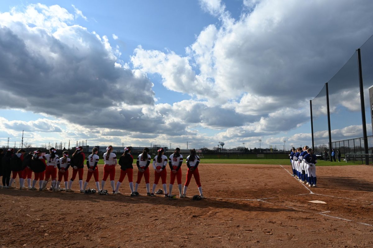 Both teams lined up for the national anthem before their game started. 