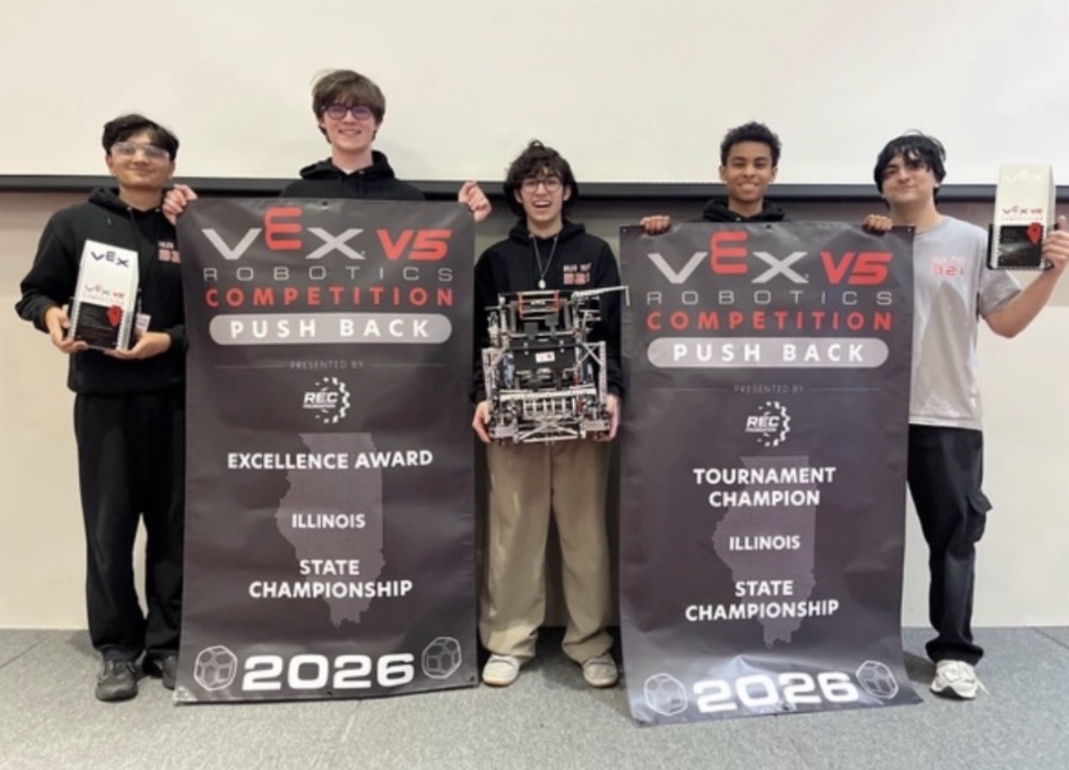 Team 321B Blastoff! posing with their vex robot.