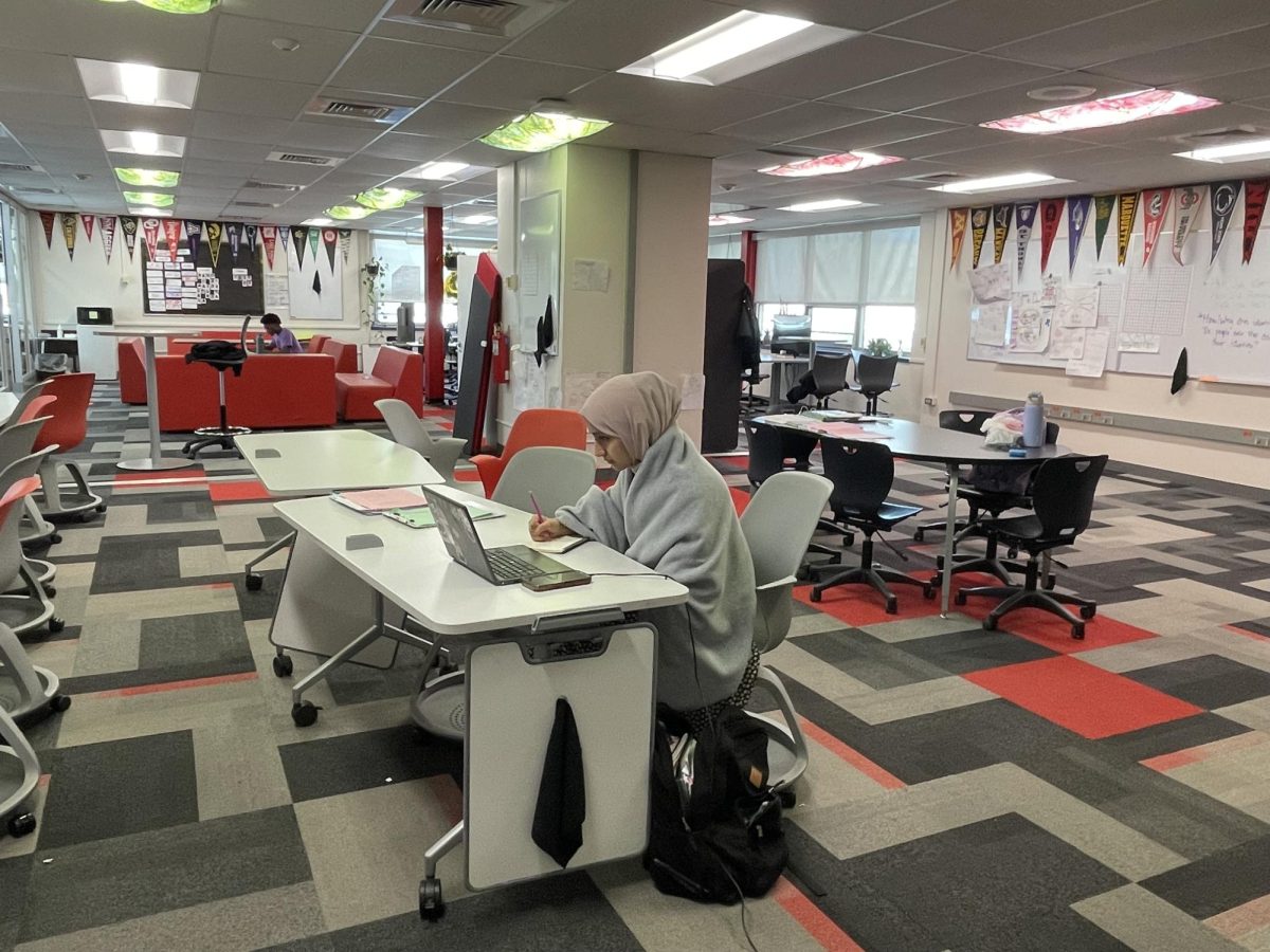 Junior Rabia Moradi studies comfortably while in AVID class.