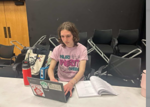 Davids in class with his Revolutionary Communists of America sticker on his Chromebook.
