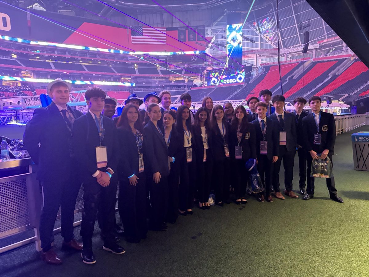 DECA poses outside the opening session at Mercedes-Benz Stadium. Photo via @westdeca on Instagram.