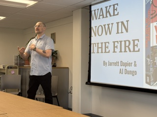 Jarrett Dapier talks about his new book "Wake Now in the Fire" in the library.